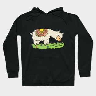 Alpaca eats grass on a meadow. Hoodie